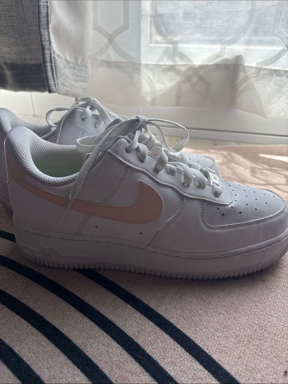 Nike Women's White Low-Top Sneakers with Pink Swoosh